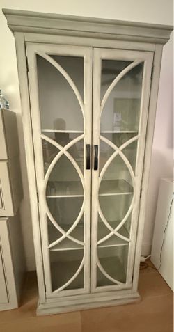 Glass enclosed shelving unit/book case