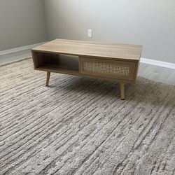 Coffee table with sliding door