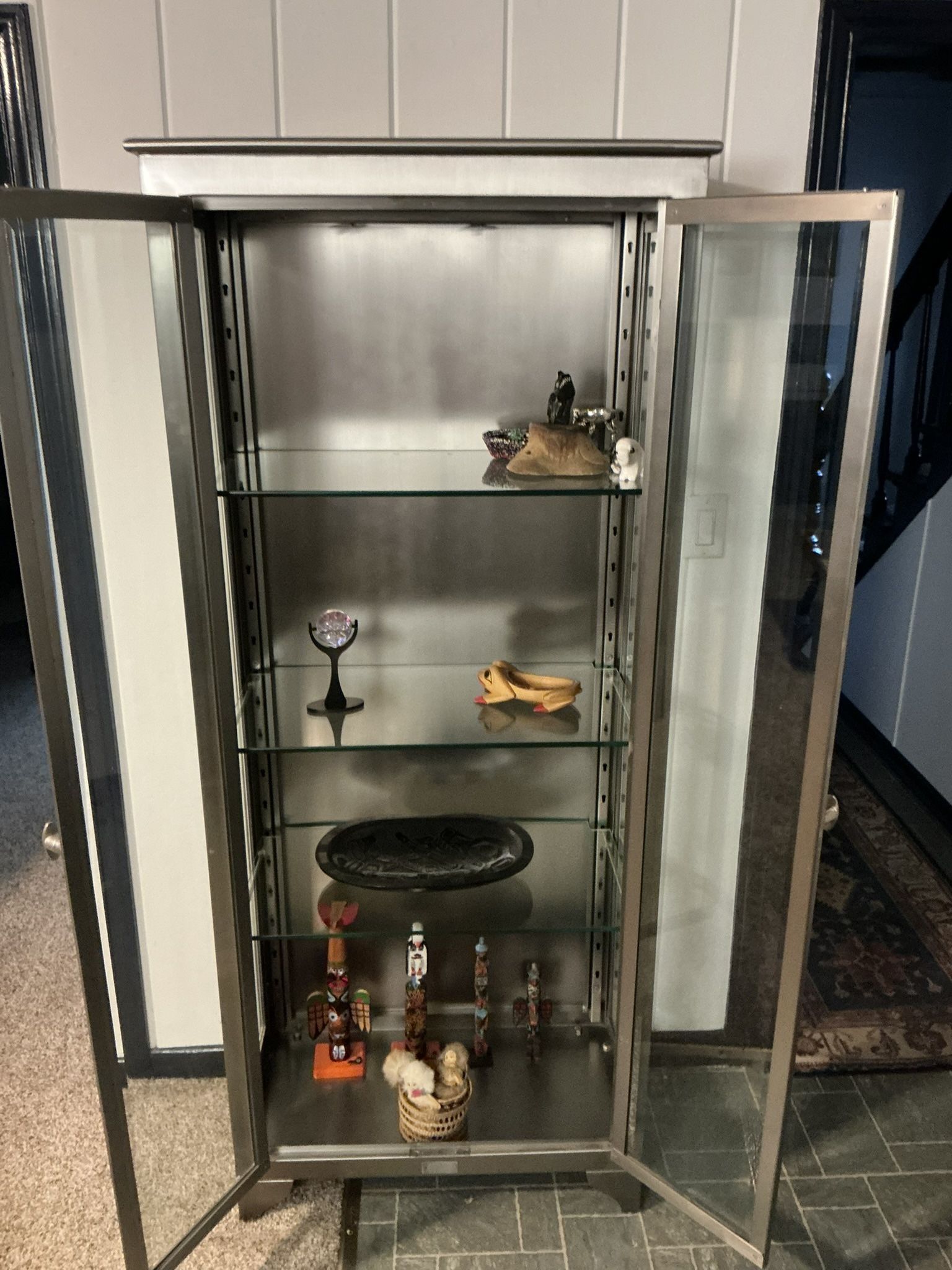 Unique, stainless steel display cabinet
