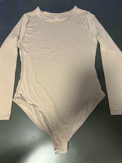 Women's long-sleeve beige bodysuit with a round neck, size L.