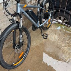 The E bike electric gear bike I got pictures from afterwards and then after modifying it got a 48 bigger 