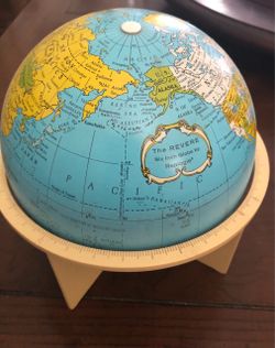 Replogle Earth six-inch metal globe with plastic stand.