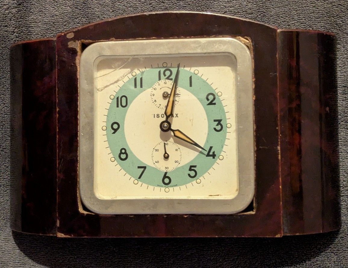 Vintage Isomax Made in Germany windup clock. Seems to run. Very cool 8.5 inch by 5 inch mid-century modern art deco glow in the dark