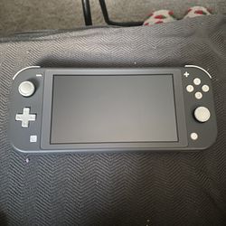 Nintendo Switch Lite and Two Games 
