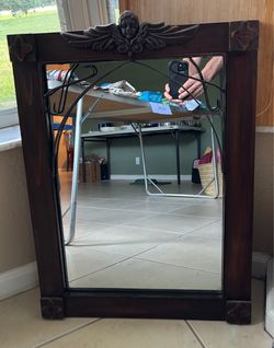 Wood framed angel mirror
