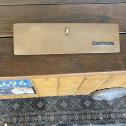 Glove Box Door off a 1975 Ford pick up.
