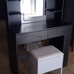 Black vanity with bench
