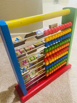 Wooden Abacus with Alphabet Learning Blocks.