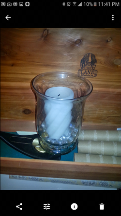 Glass hurricane with candle