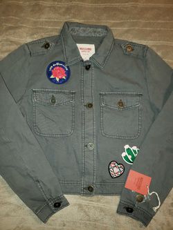 New with tags! Gray denim jacket with patches.