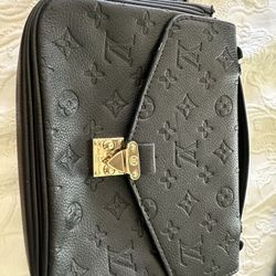 Louis Vuitton Pochette Metis in black Monogram Empreinte leather. Made in France with date code SP1299 (2019).