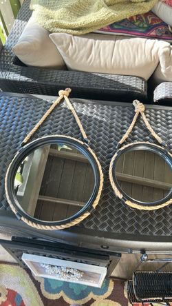 Heavy metal and rope nautical mirrors. Large 15 inches, small 111 inches.