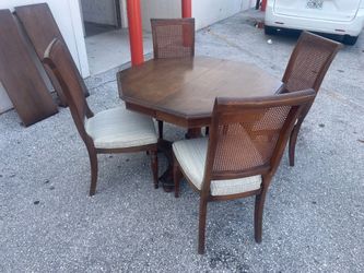 Solid wood table with 4 chairs and extra leaf