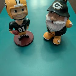 Green Bay Packers themed collectibles featuring a football player bobblehead and a team gnome
