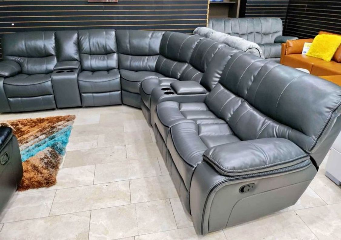 Going out of business sale. Madrid gray leather reclining sectional now $1599. Easy finance option. Same-day delivery