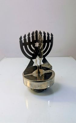 Yaacov Agam kinetic Hanukkah menorah spinning silver plated music box.