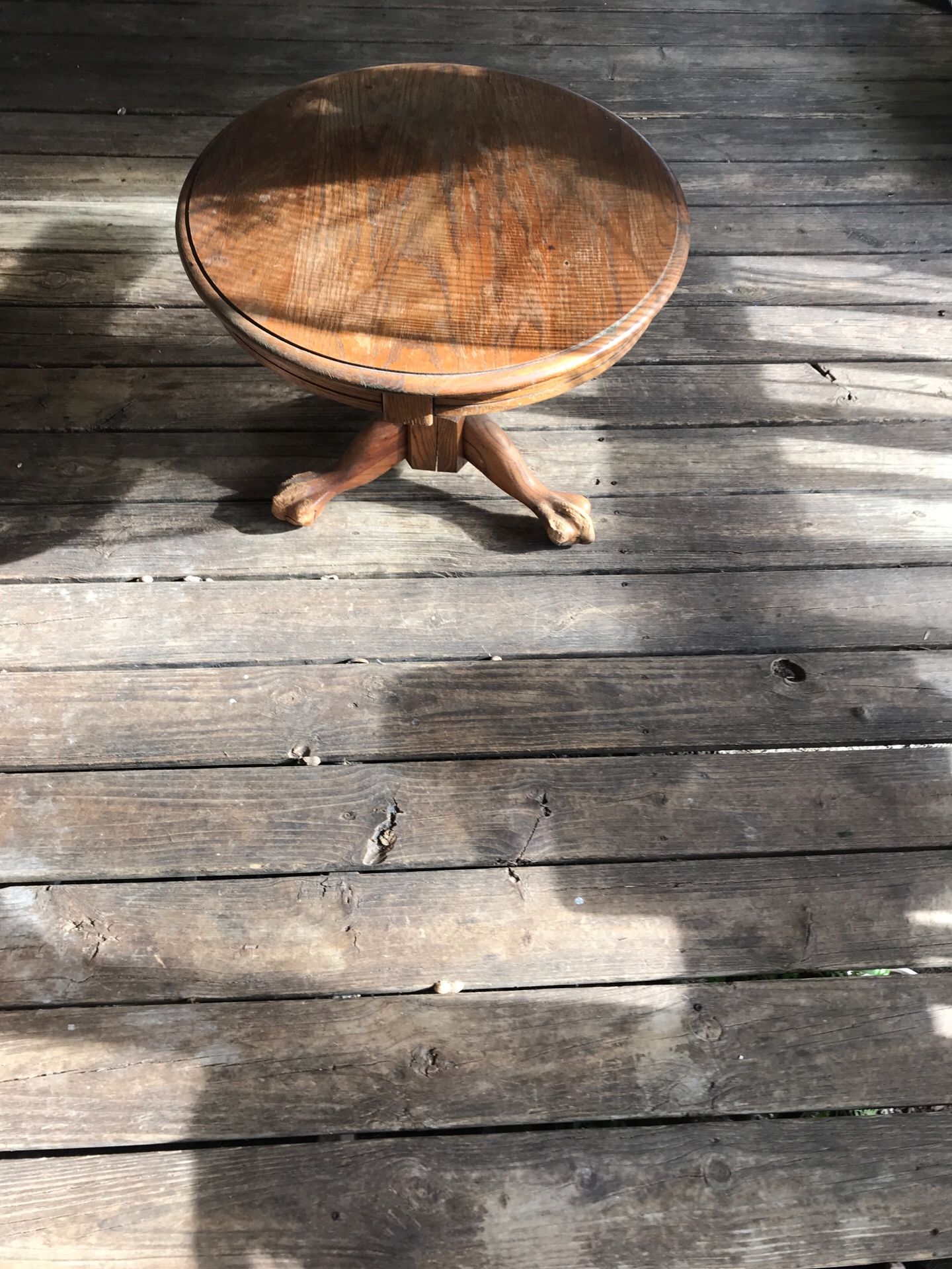 Antique coffee table stands on feet