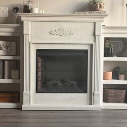 White electric fireplace with built-in side shelves