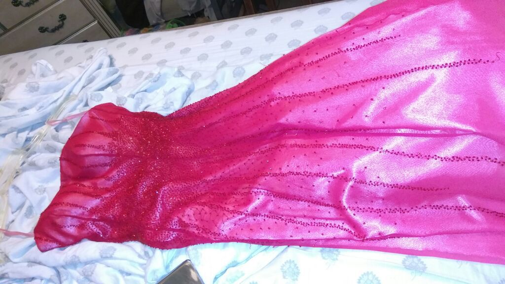 Prom dress red beaded on top and at the bottom fainted pinkish white