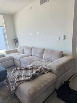 Couch, rug, and ottoman