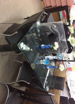 Glass table with 4 chairs for $399
