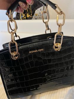 Michael Kors Cynthia small satchel, featuring black crocodile-embossed leather and chain-trimmed top handles.