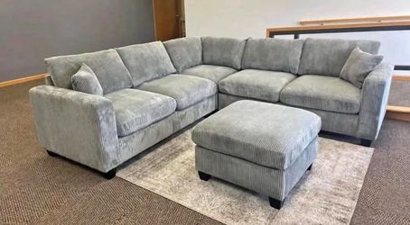 Brand new fog color grey corduroy Sectional Sofa with ottoman and 2 accent pillows.