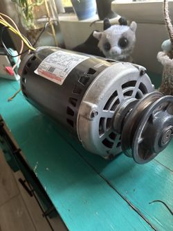 Electric motor for an AC unit