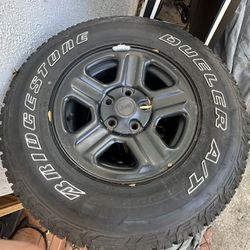 Set of five Jeep 16” wheels on Bridgestone Revo tires. low miles