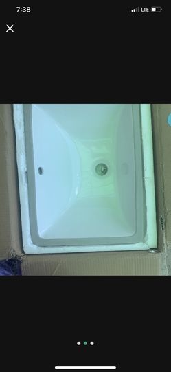 2 Sinks With Brass Faucets