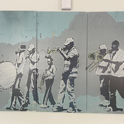 Banksy's "Gas Mask Wearing Musicians" street art, created in New Orleans in 2008. 
