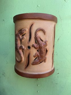   a handmade terra-cotta pottery wall art sconce   $35.00 Each One 