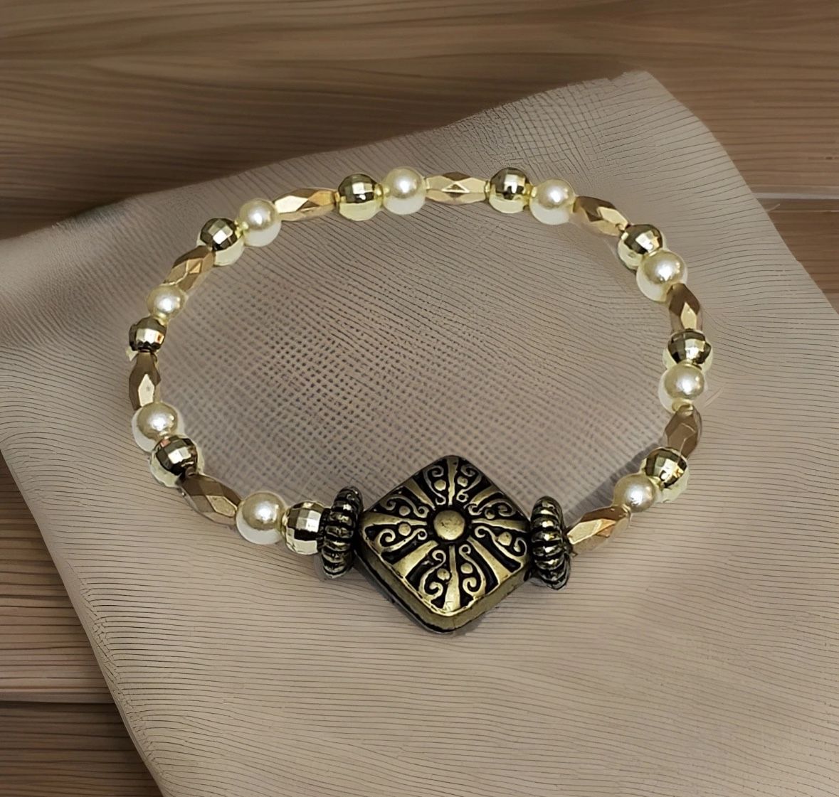 NEW Beaded flexible Bracelet Gold color with antique charm