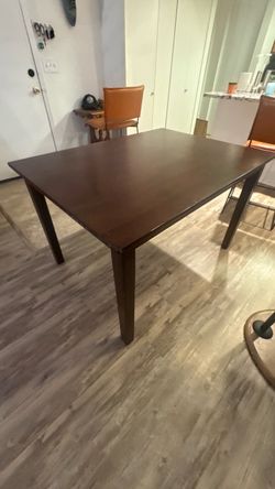 Apartment-sized solid wood dining table