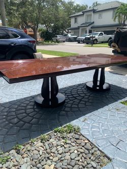 Large wood dining set, includes 12 matching chairs and buffet.