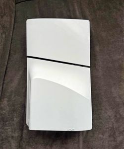 Playstation 5 Slim 1Tb with controller, hdmi cord, power cord and charger.