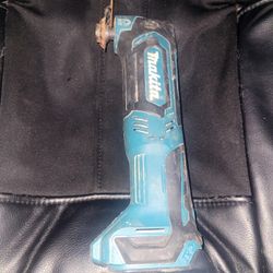 This is a Makita 12V max CXT Lithium-Ion Cordless Oscillating Multi-Tool, identified specifically as model MT01Z or TM30DZ.