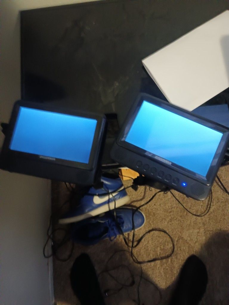 2 SYLVANIA DVD PLAYERS AND a Double Din Boss Radio