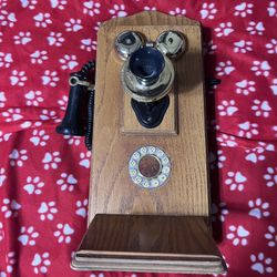 antique wood and brass wall-mounting hand-crank telephone
