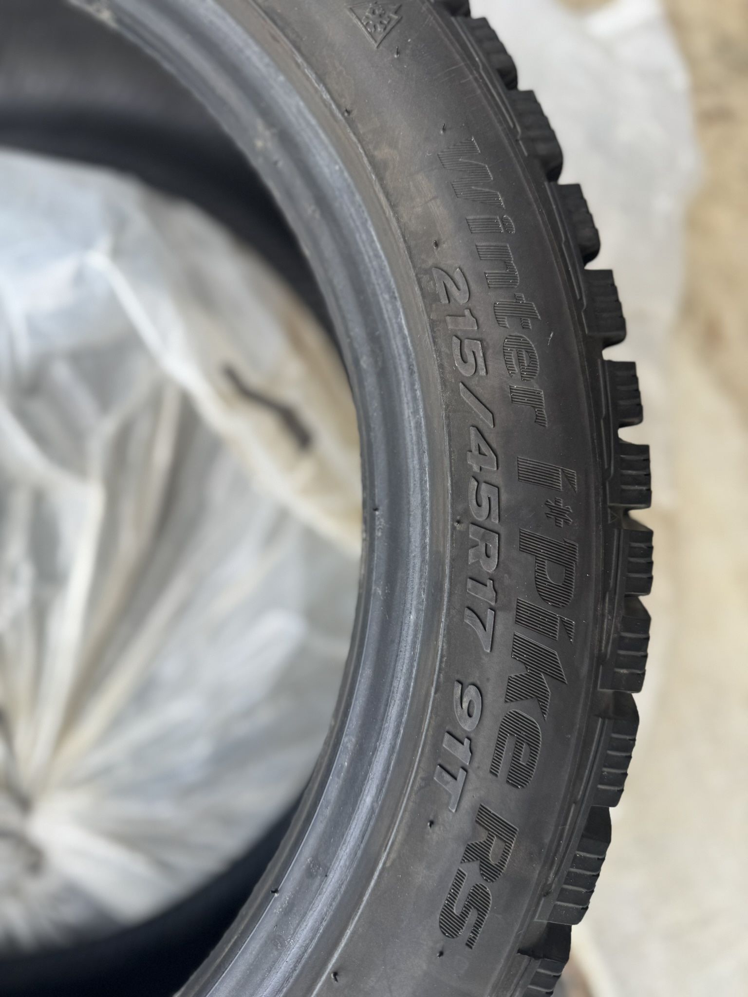 Set of 4 215/45R17 studded snow tires