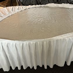 GENTLY USED WHITE TABLE SKIRT approximately 21’  (un-stretched) with 12 clips