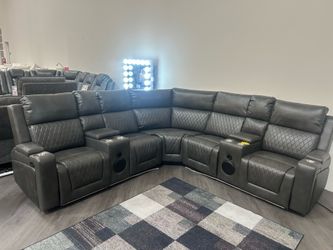 Brand new power reclining grey leather sectional w speakers