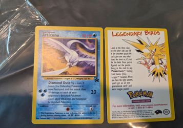 2000 Pokémon Black Star Promo Articuno (#22), featuring artwork by Toshinao Aoki.
I opened the package to reveal the card inside.  
I have a few seale