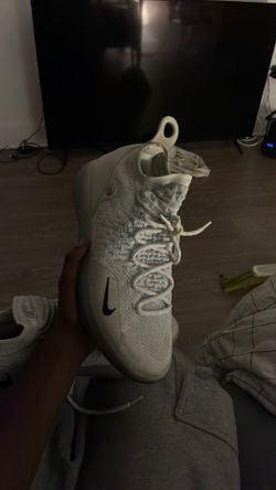 Nike KD 17 basketball shoes, in the White/Black (“Triple White”) colorway.