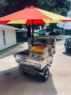 Hot dog cart with grill