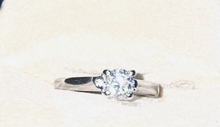 Women’s Harry Winston Diamond and Platinum Engagement Ring
