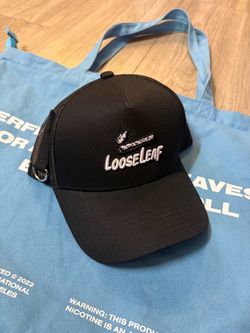 ALOCS X LOOSE LEAF BUNDLE W/ LOOSE LEAF TOTE BAG, 2 CLASSIC ALOCS SHIRTS, LOOSE LEAF HAT, LOOSE LEAF PRODUCTS. ALL MERCHANDISE LISTED AS BUNDLE