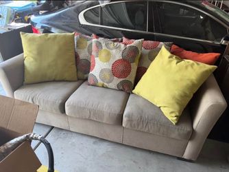 Beige Three-Cushion Sofa with Accent Pillows And matching love seat Two-cushion
