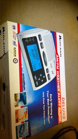 Midland WR300 Deluxe NOAA Emergency Weather Alert Radio featuring a large blue backlit LCD screen.