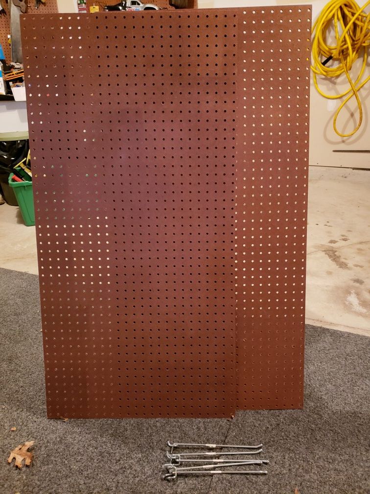 Like new, 2 pieces of pegboard. 2x4x 5.2mm. Also includes 5 10 inch pegs. Retais for more than $30